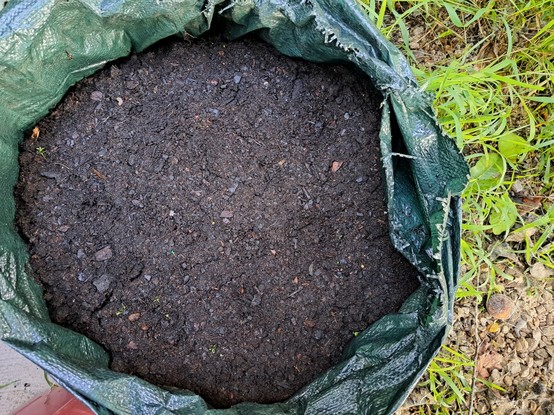 A planting bag filled with compost