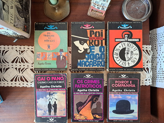 Six Portuguese editions of Poirot stories depicting Poirot in the cover