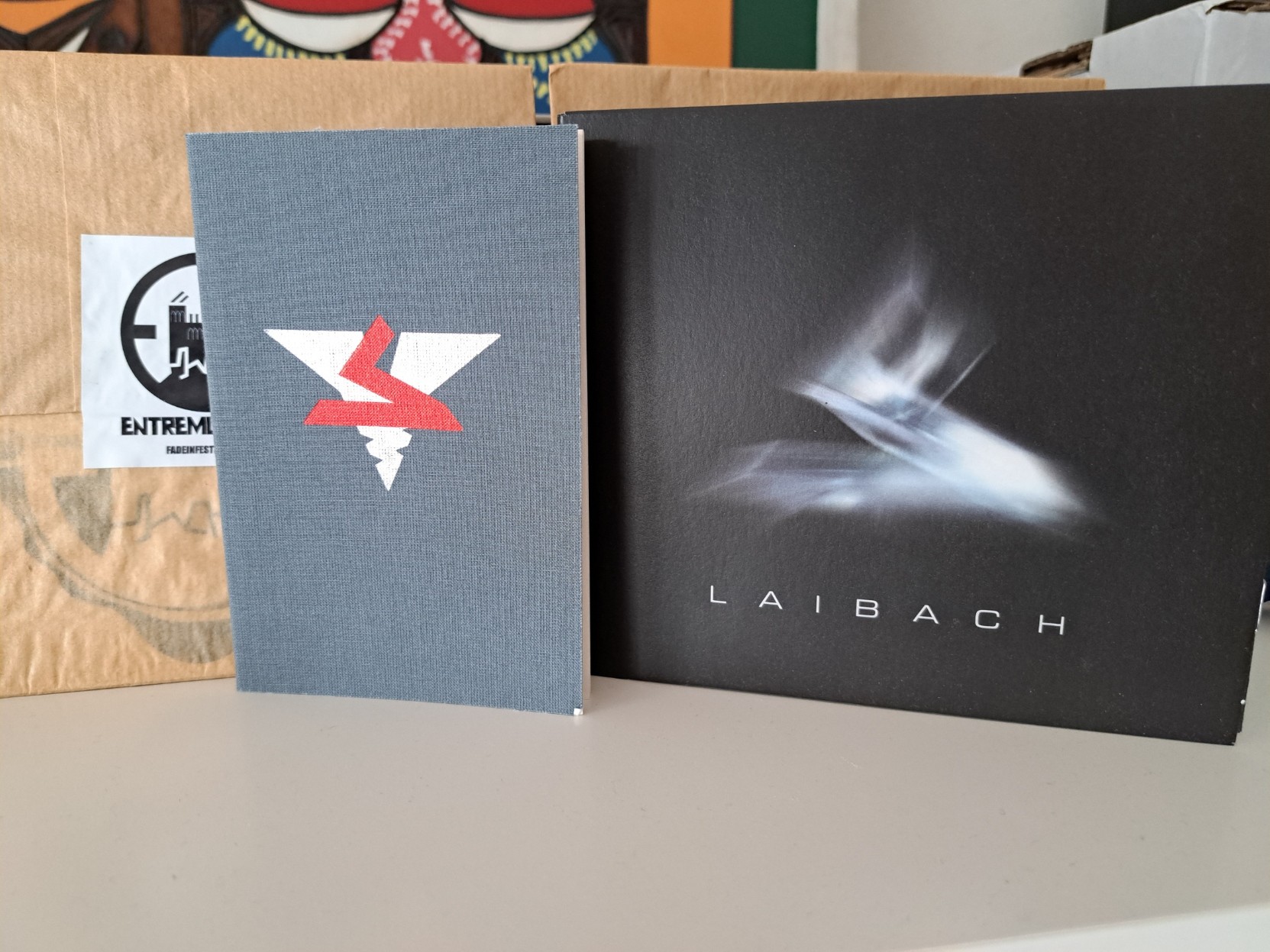 Laibach&rsquo;s CD edition of Spectre, next to its &ldquo;Party Book&rdquo;.