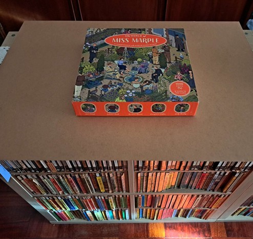 A wooden frame with a puzzle box on top